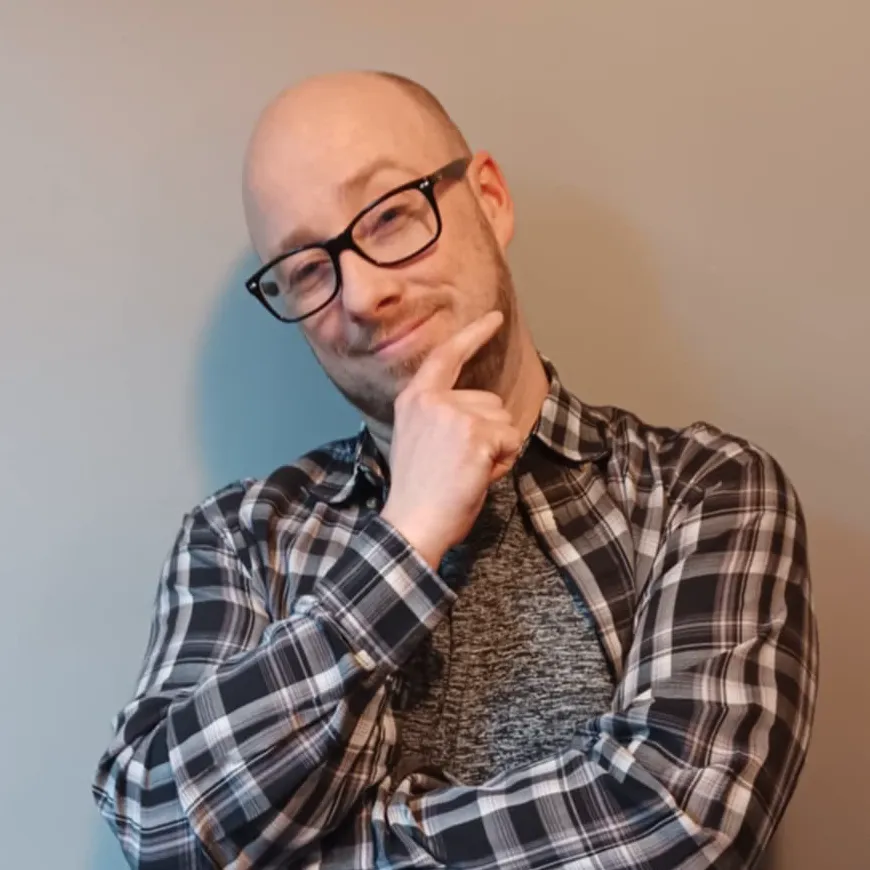 man with plaid shirt and glasses